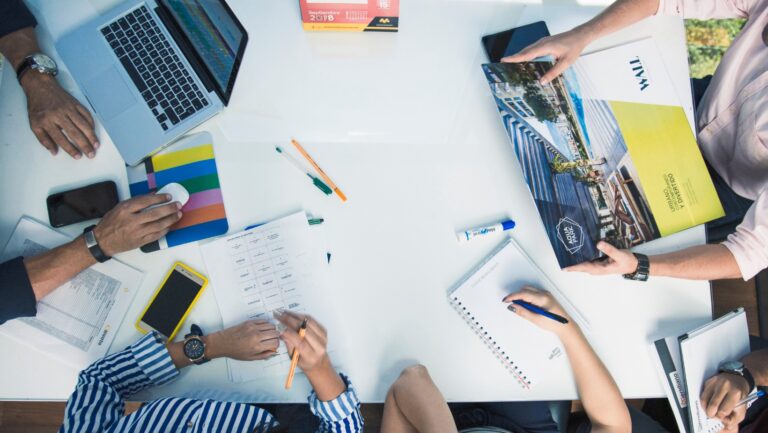 Bright glitch-style visual showing neon pink and blue digital patterns representing modern technology.